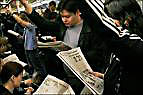 reading newspapers